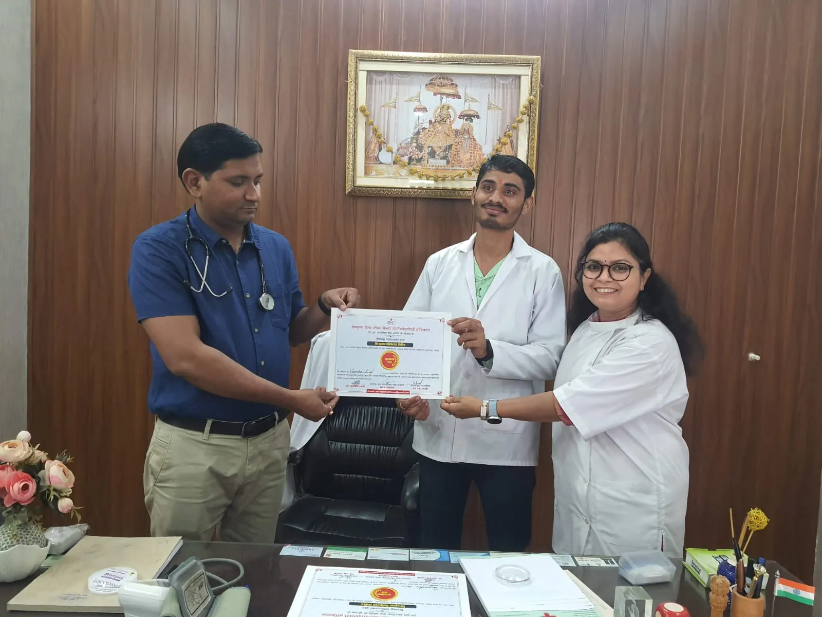 Dr. Jahanvi Tyagi receiving a certificate alongside colleagues