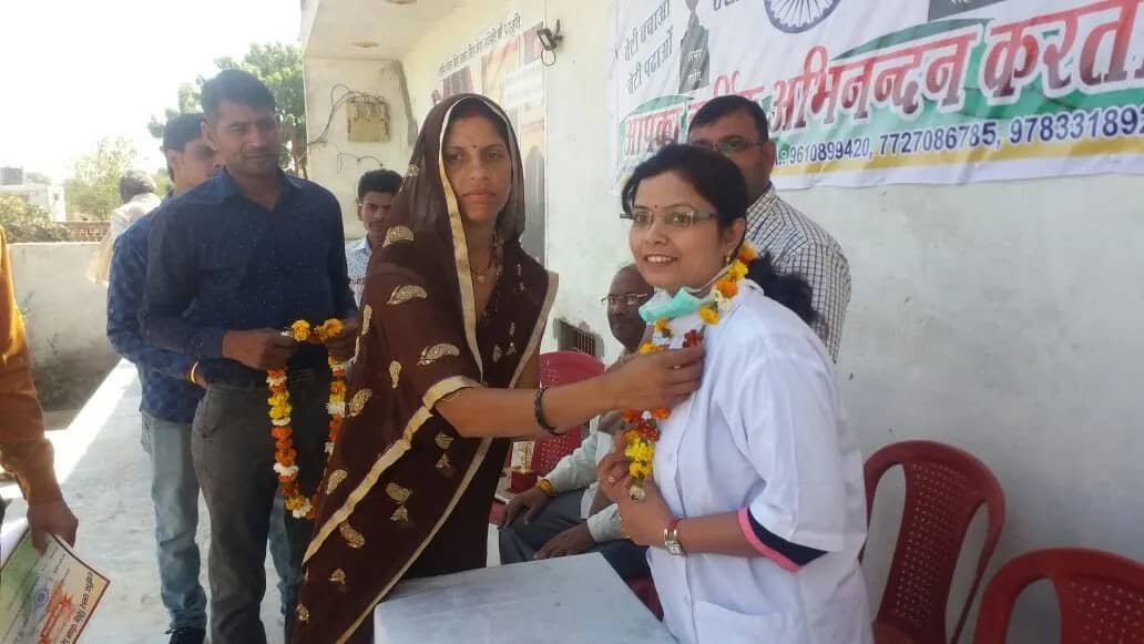 Dr. Jahanvi Tyagi being welcomed with a garland at a community event
