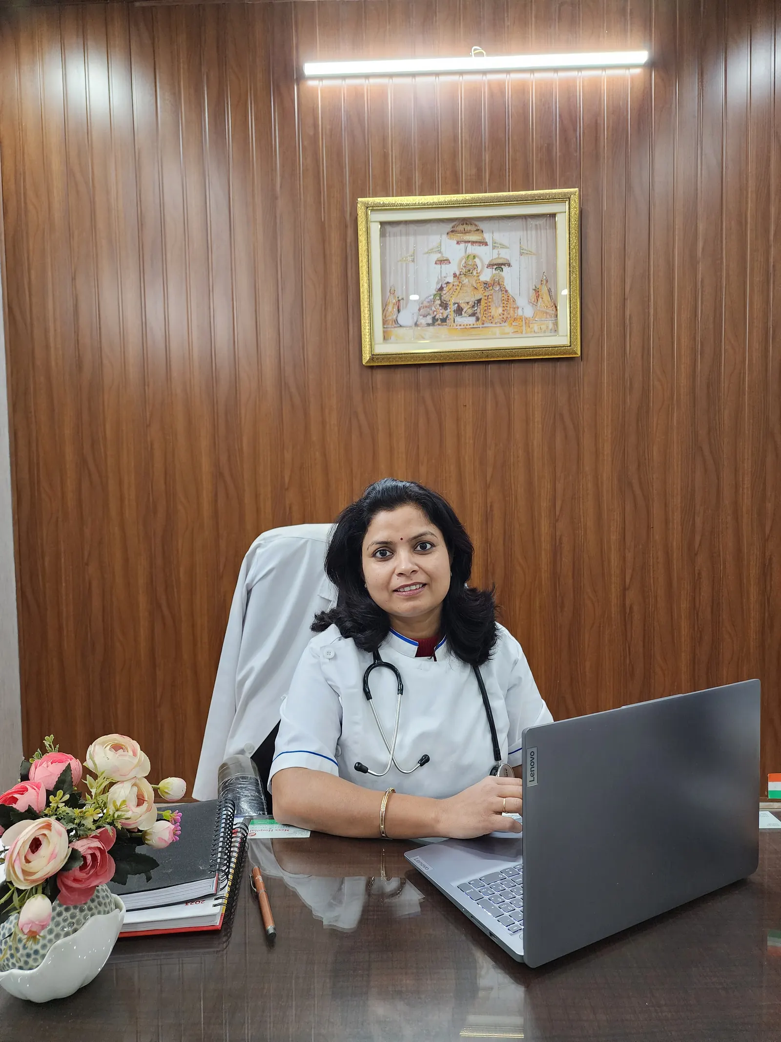 Dr. Jahanvi Tyagi at her desk in the consultation room