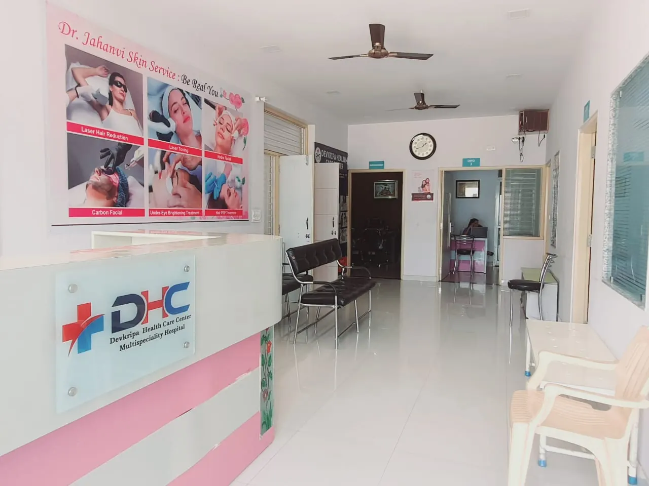Clinic reception with the Devkripa Healthcare desk and waiting chairs